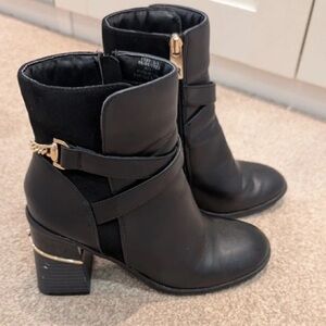 Chic Black Heeled Boots with Gold Accents